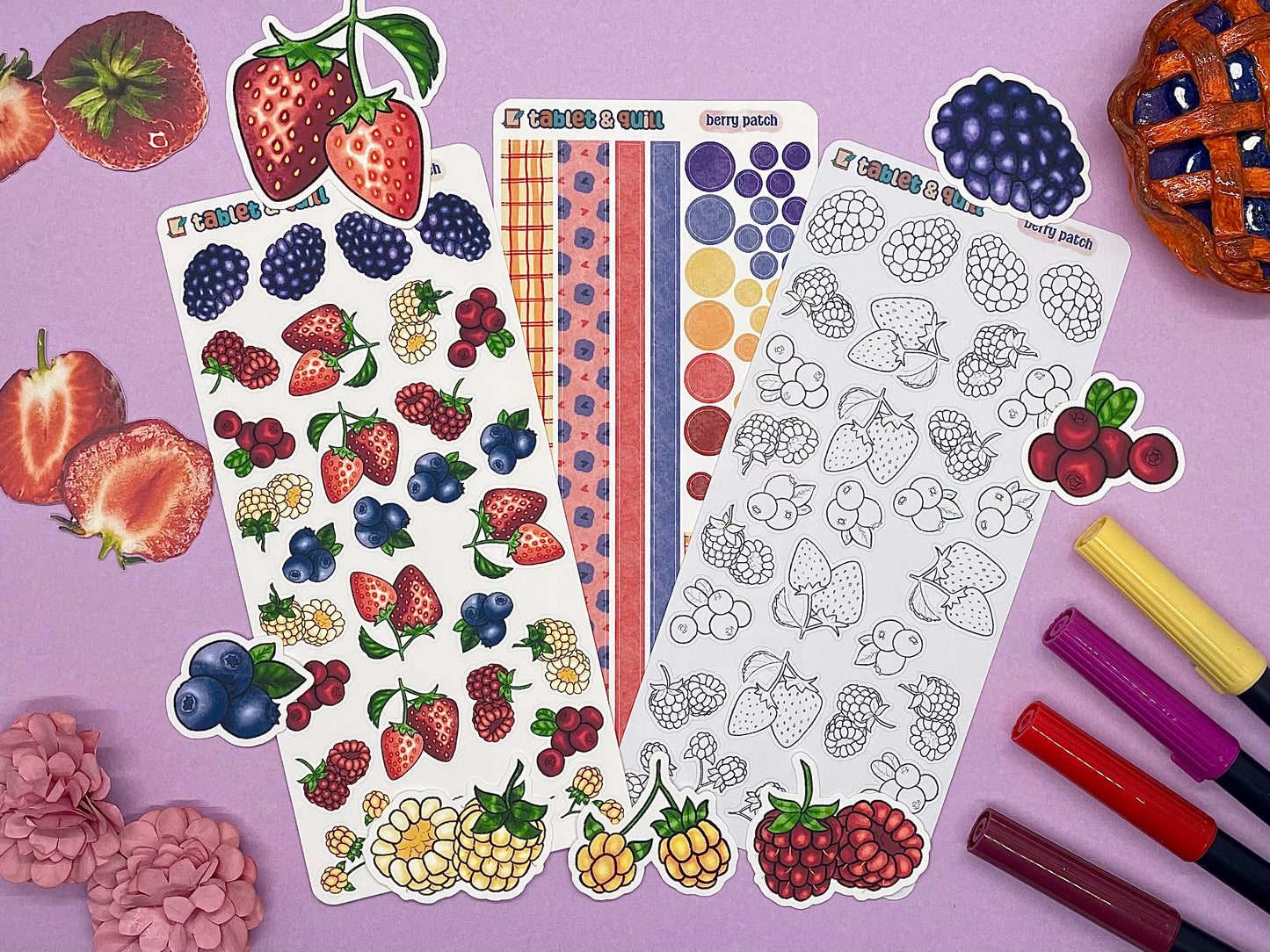 An overview image of berries themed stickers, including a color sticker sheet, a colorable sticker sheet, a decorative sticker sheet, and die cut sticker flakes.