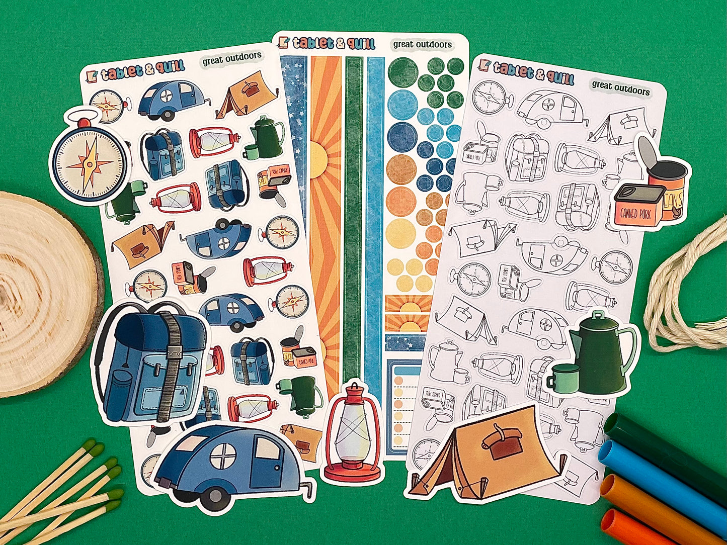 An overview image of camping themed stickers, including a color sticker sheet, a colorable sticker sheet, a decorative sticker sheet, and die cut sticker flakes.