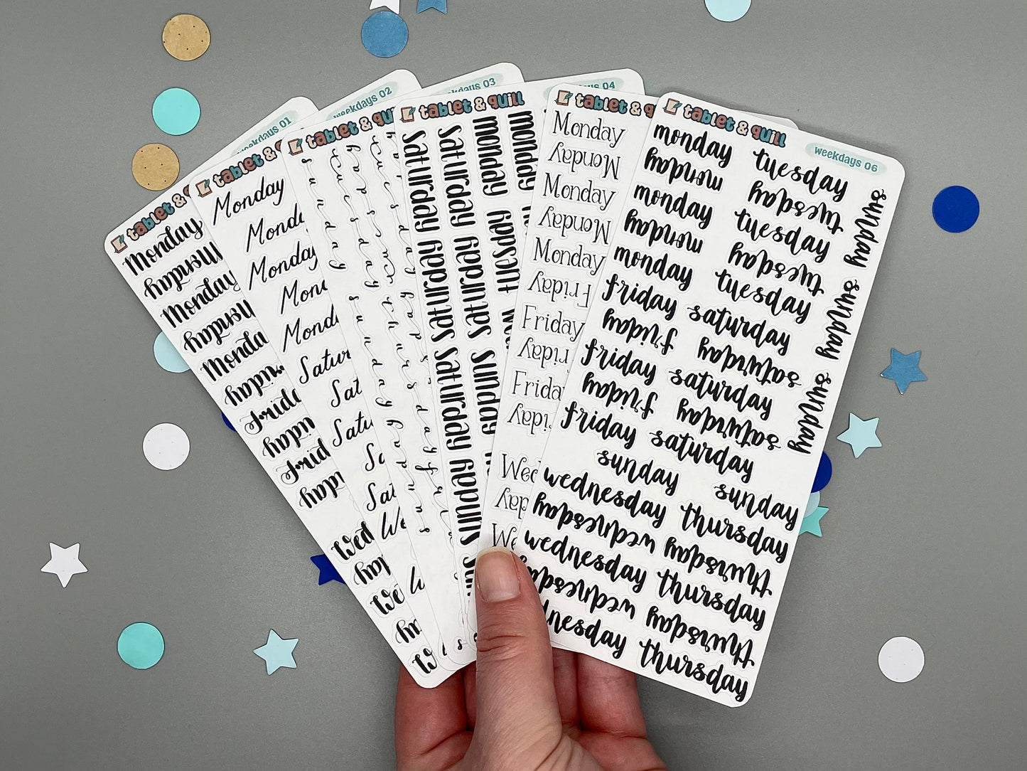 Weekday sticker sheets in 6 styles fanned out.