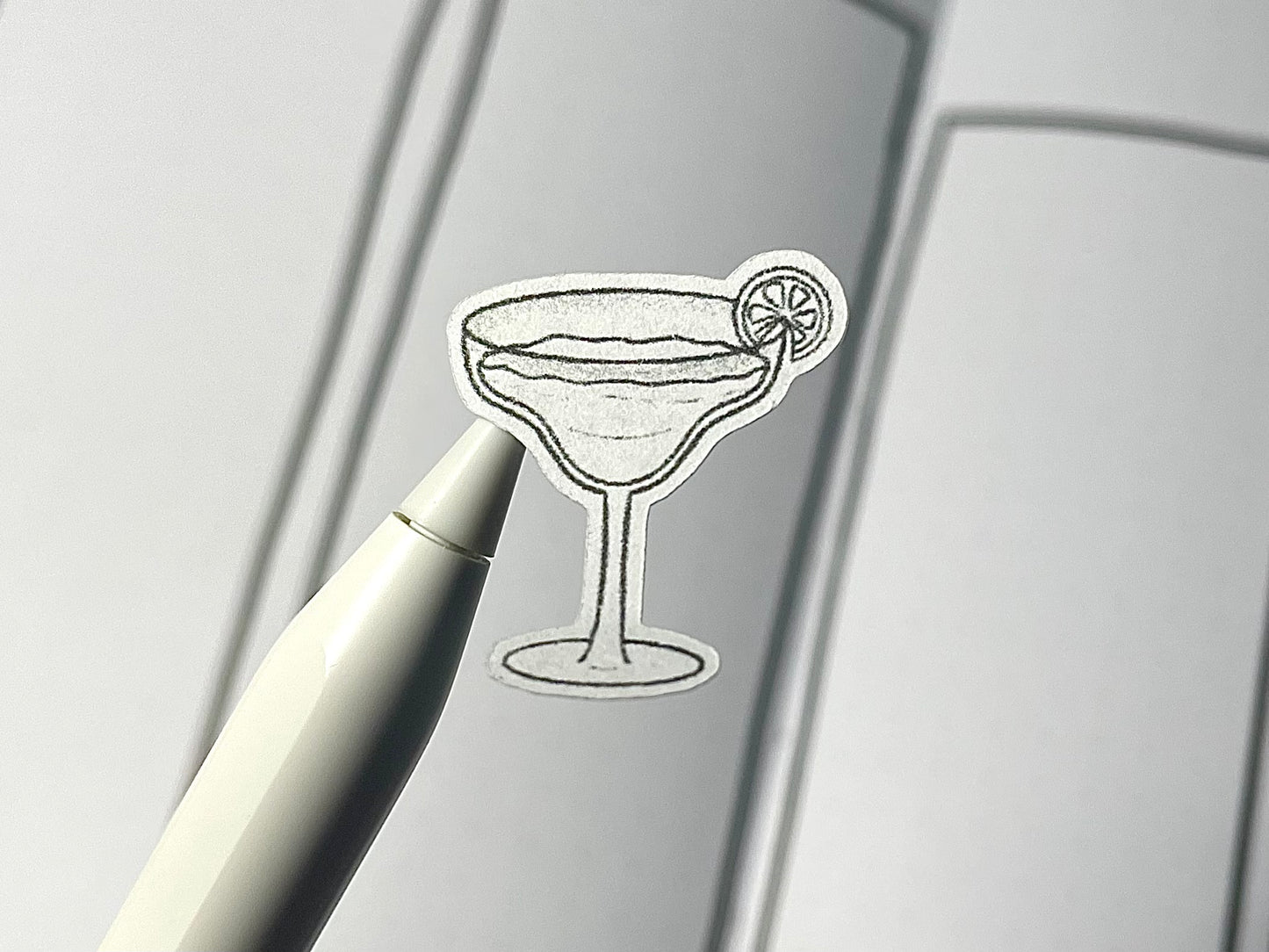 Closeup of a diy color cocktail themed sticker over a journal spread.