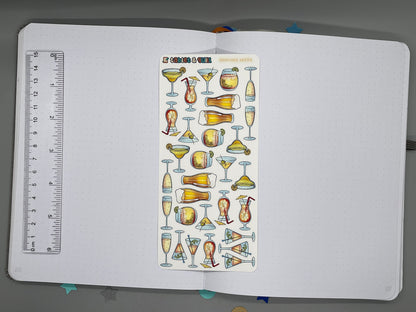 Tropical drinks themed color sticker sheet on an open bullet journal with a ruler for scale.