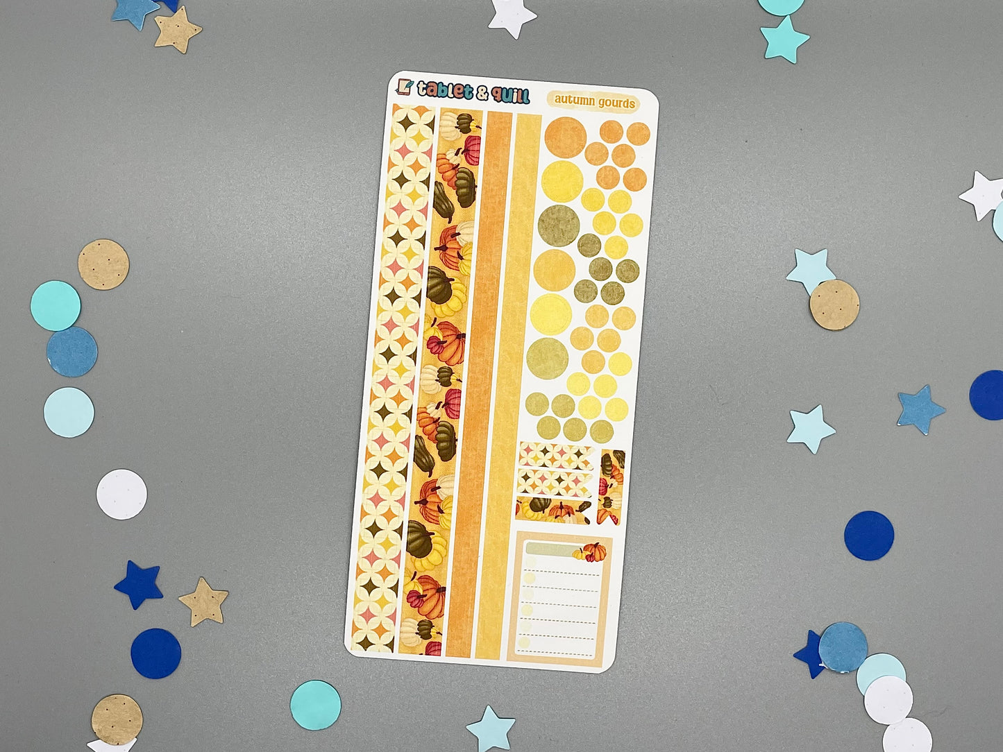 Decorative pumpkin themed sticker sheet on a gray background with confetti.