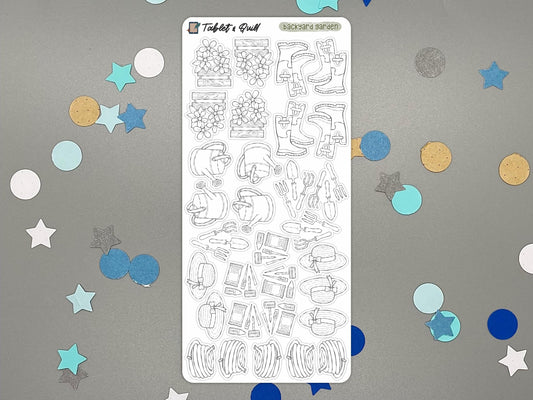 Black and white garden themed sticker sheet over a gray surface and confetti.