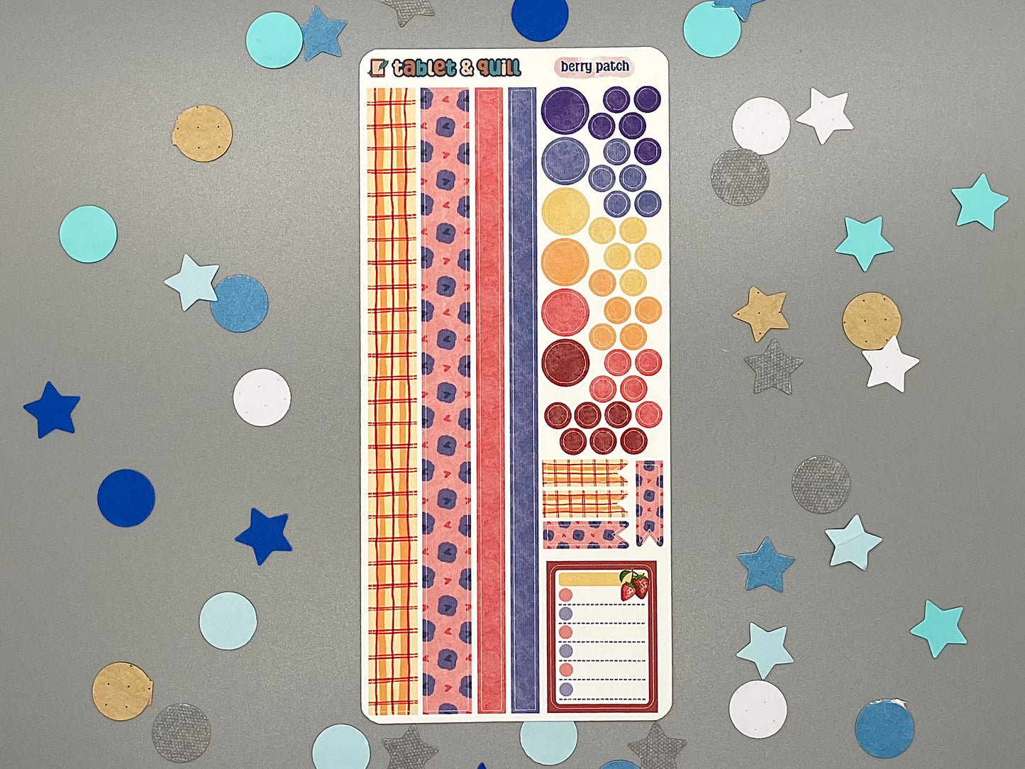 Decorative berry themed sticker sheet on a gray background with confetti.