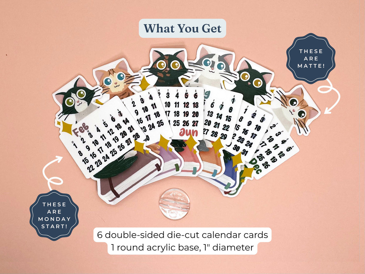 A set of six die-cut calendar cards featuring cartoon cat illustrations and monthly grids, arranged on a peach background with text describing the contents and a round acrylic base.