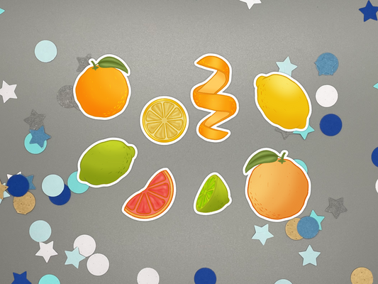 Set of colorful citrus themed bullet journal stickers on a gray background with decorative elements.