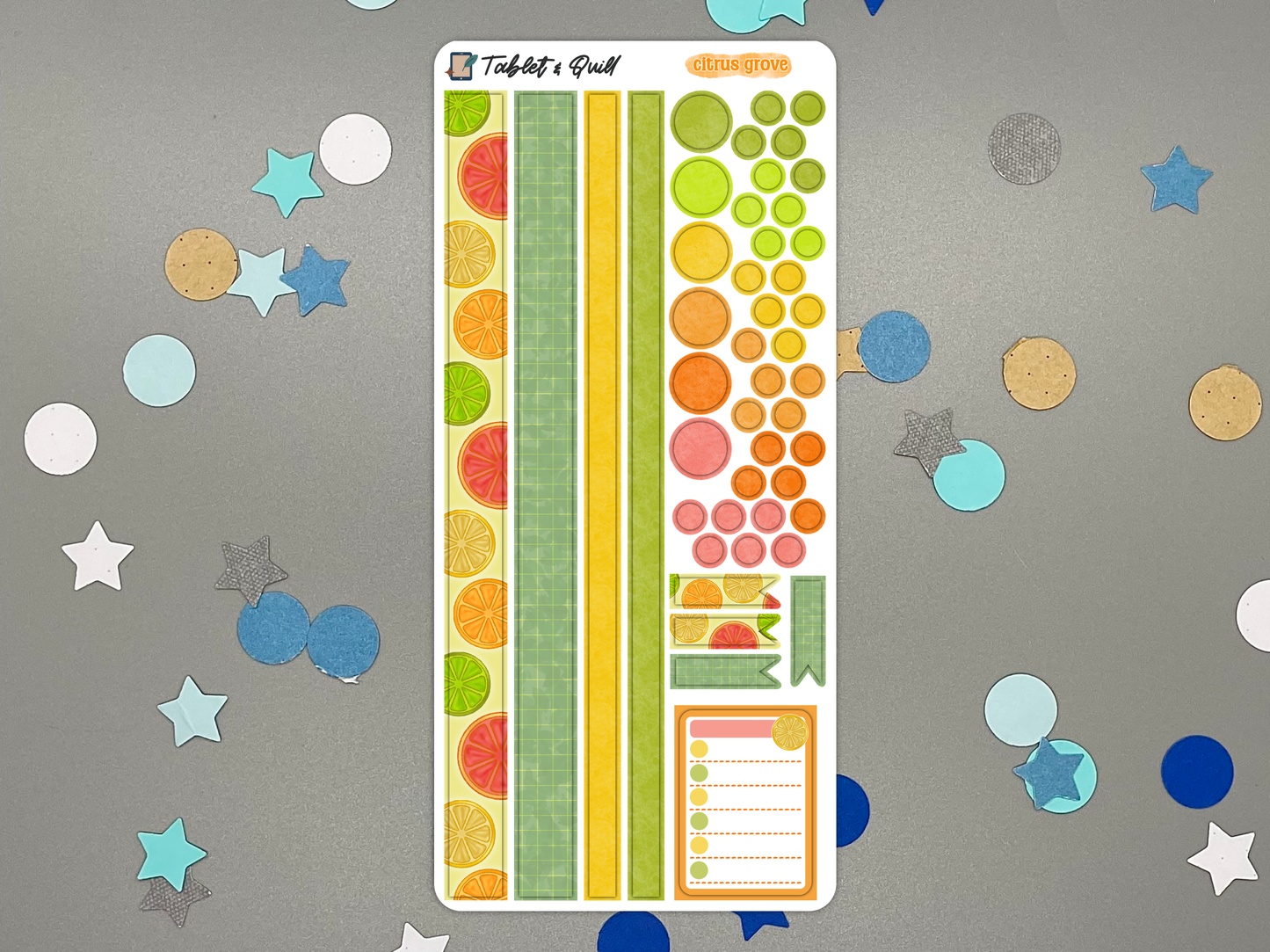 Colorful citrus themed decorative bullet journal stickers on a gray background with decorative elements.