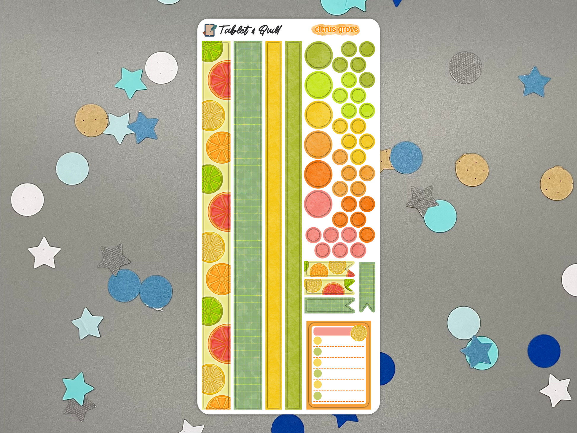 Colorful citrus themed decorative bullet journal stickers on a gray background with decorative elements.