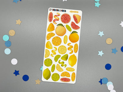 Sheet of colorful fruit-themed stickers on a gray background with confetti.