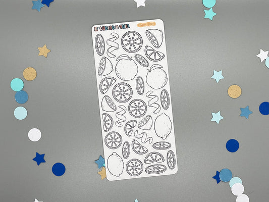 Sticker sheet of black and white fruit-themed stickers over a gray background with decorative confetti.