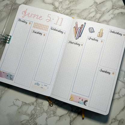 An overview image of a crystals themed bullet journal weekly spread.