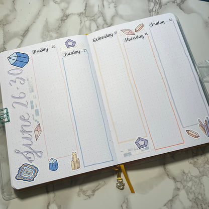 An overview image of a crystals themed bullet journal weekly spread.