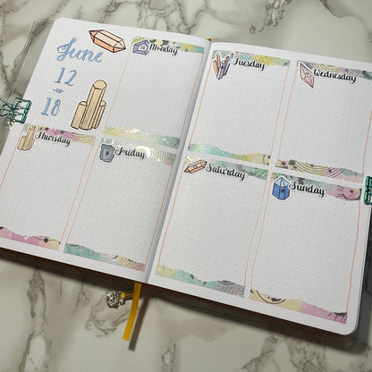 An overview image of a crystals themed bullet journal weekly spread.
