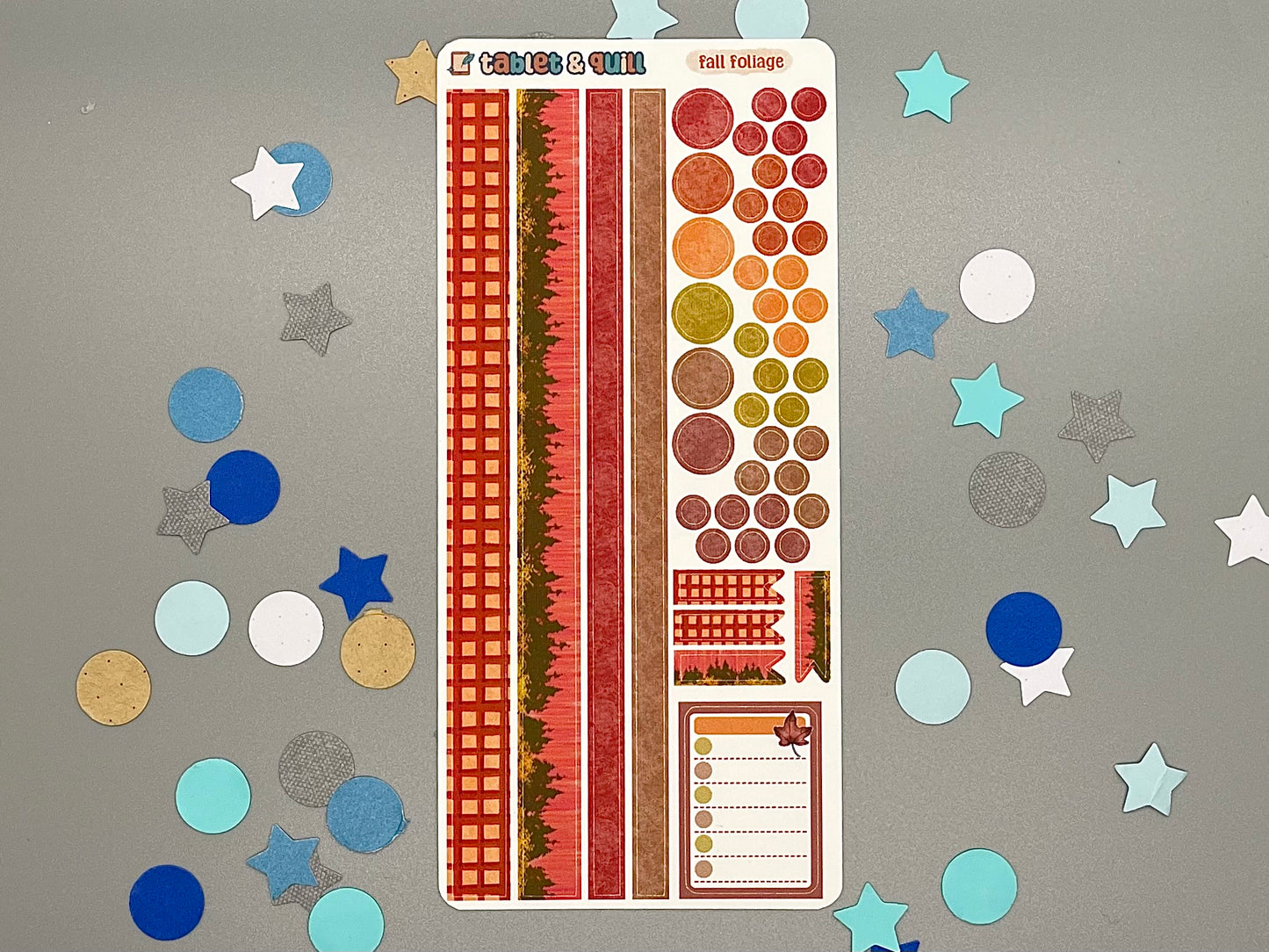 Decorative sticker sheet with washi strips and circle dots that match with the Fall Foliage sticker set on gray background with confetti.