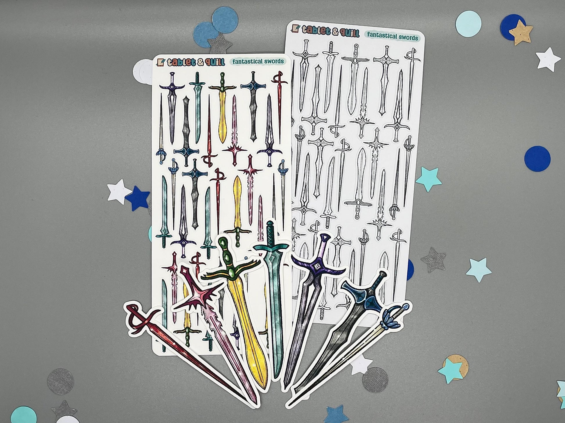 An overview image of swords themed stickers, including a color sticker sheet, a colorable sticker sheet, and die cut sticker flakes.