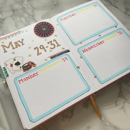 An overview image of a casino themed bullet journal weekly spread.