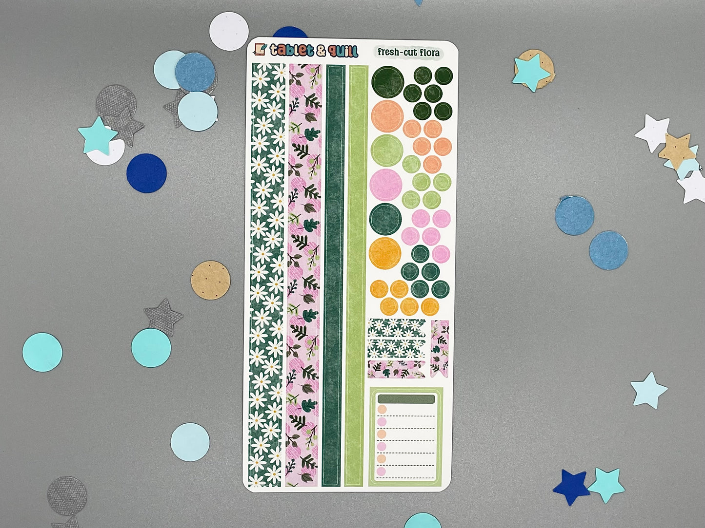 Sticker sheet with matching design as our fresh-cut flowers themed stickers on a gray background with decorative stars and circles.