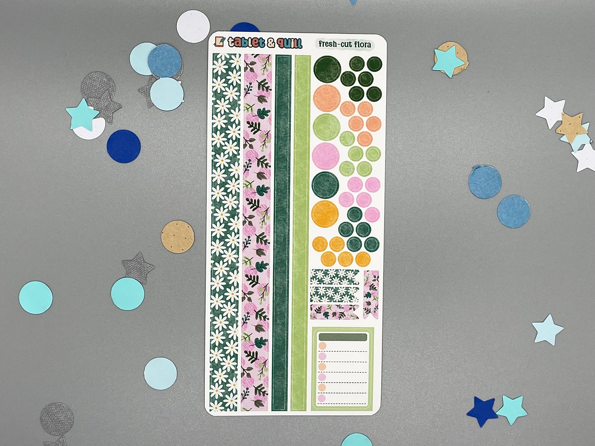 Sticker sheet with matching design as our fresh-cut flowers themed stickers on a gray background with decorative stars and circles.