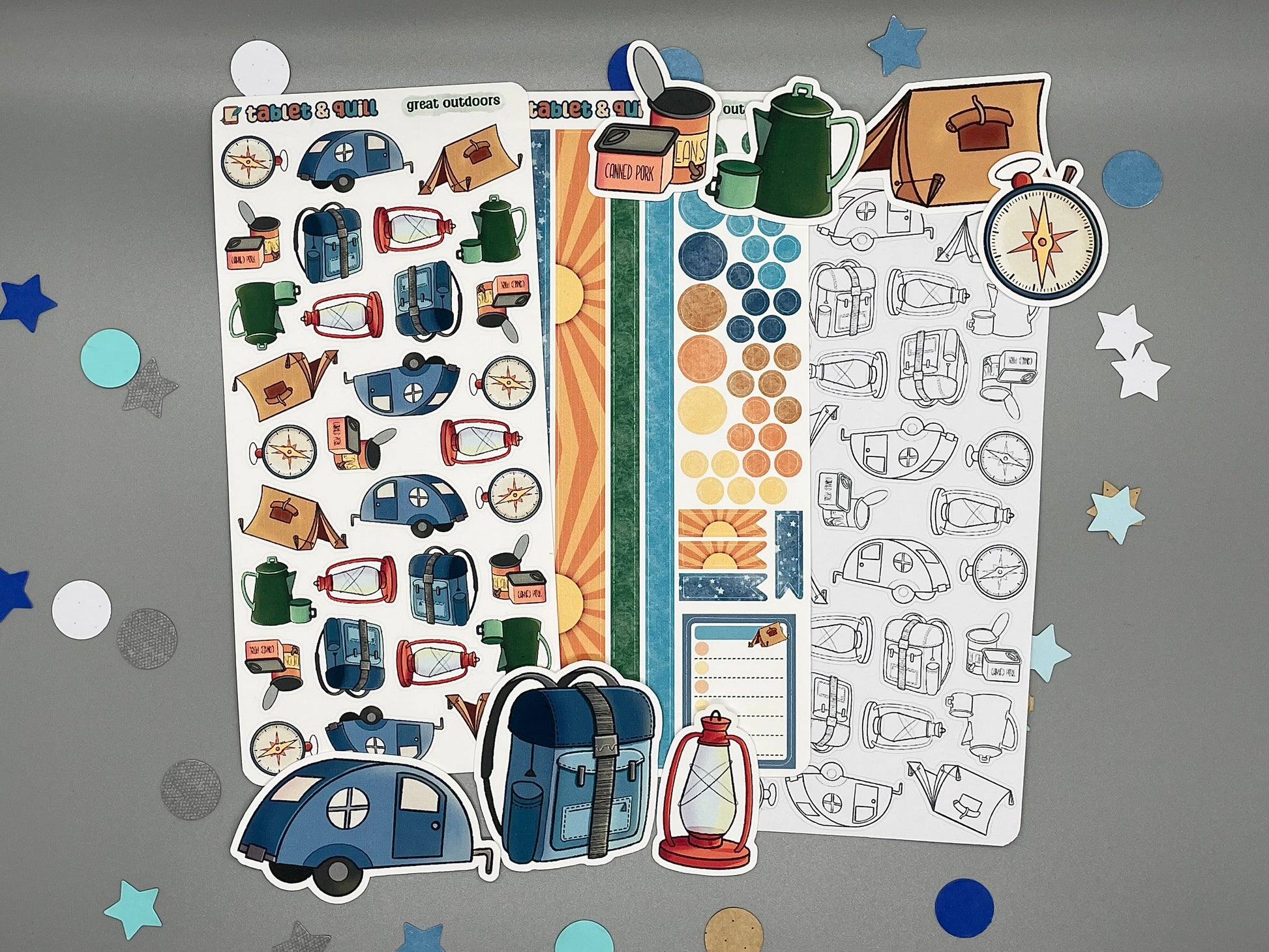 An overview image of camping themed stickers, including a color sticker sheet, a colorable sticker sheet, a decorative sticker sheet, and die cut sticker flakes.