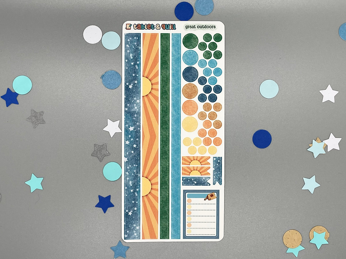 Sticker sheet with various designs matching the great outdoors camping themed sticker set on a gray background with decorative elements.