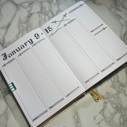 Weekly bullet journal medieval swords themed spread.