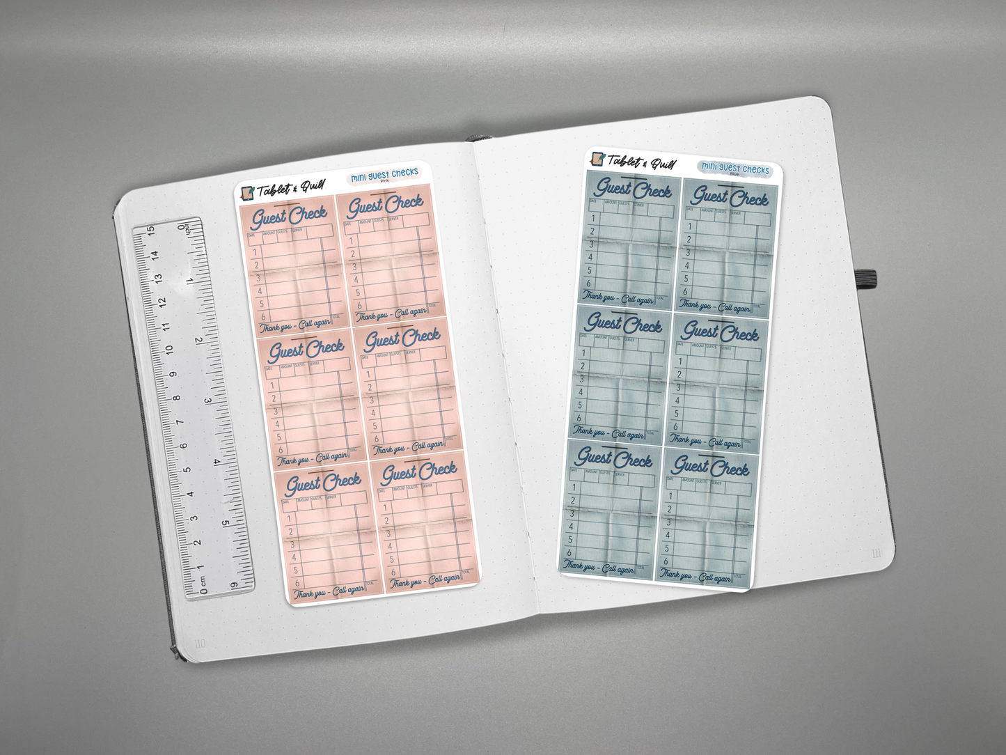 Two mini guest check sticker sheets on a journal with a ruler for scale on a gray background.