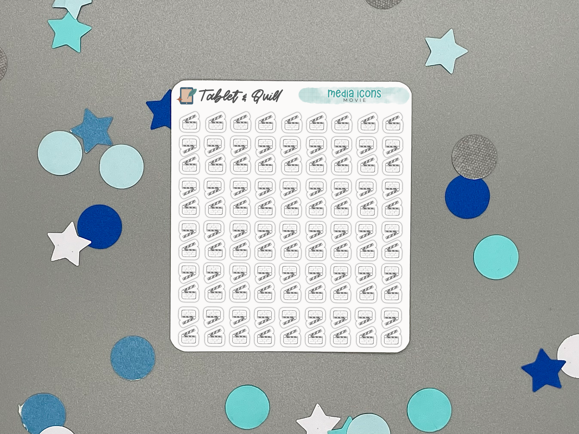 Sheet of mini planner stickers with movie clapper icons on a gray background with decorative stars and circles.