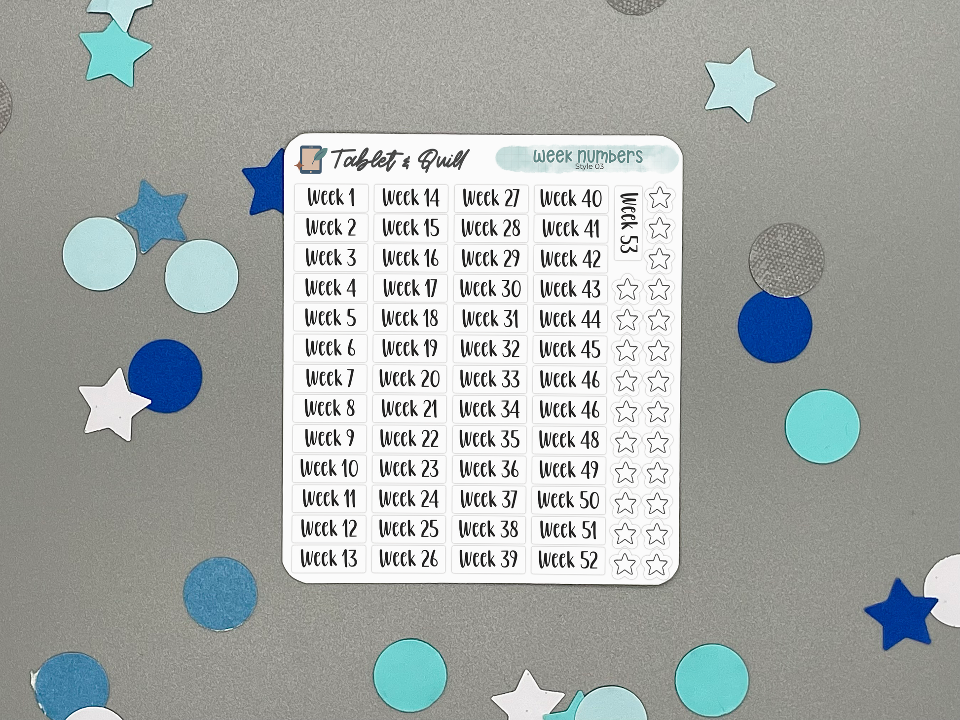 Planner sticker sheet with week numbers on a gray background with decorative stickers.