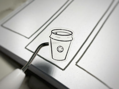 Closeup of a coffee colorable sticker for bullet journals and planners.