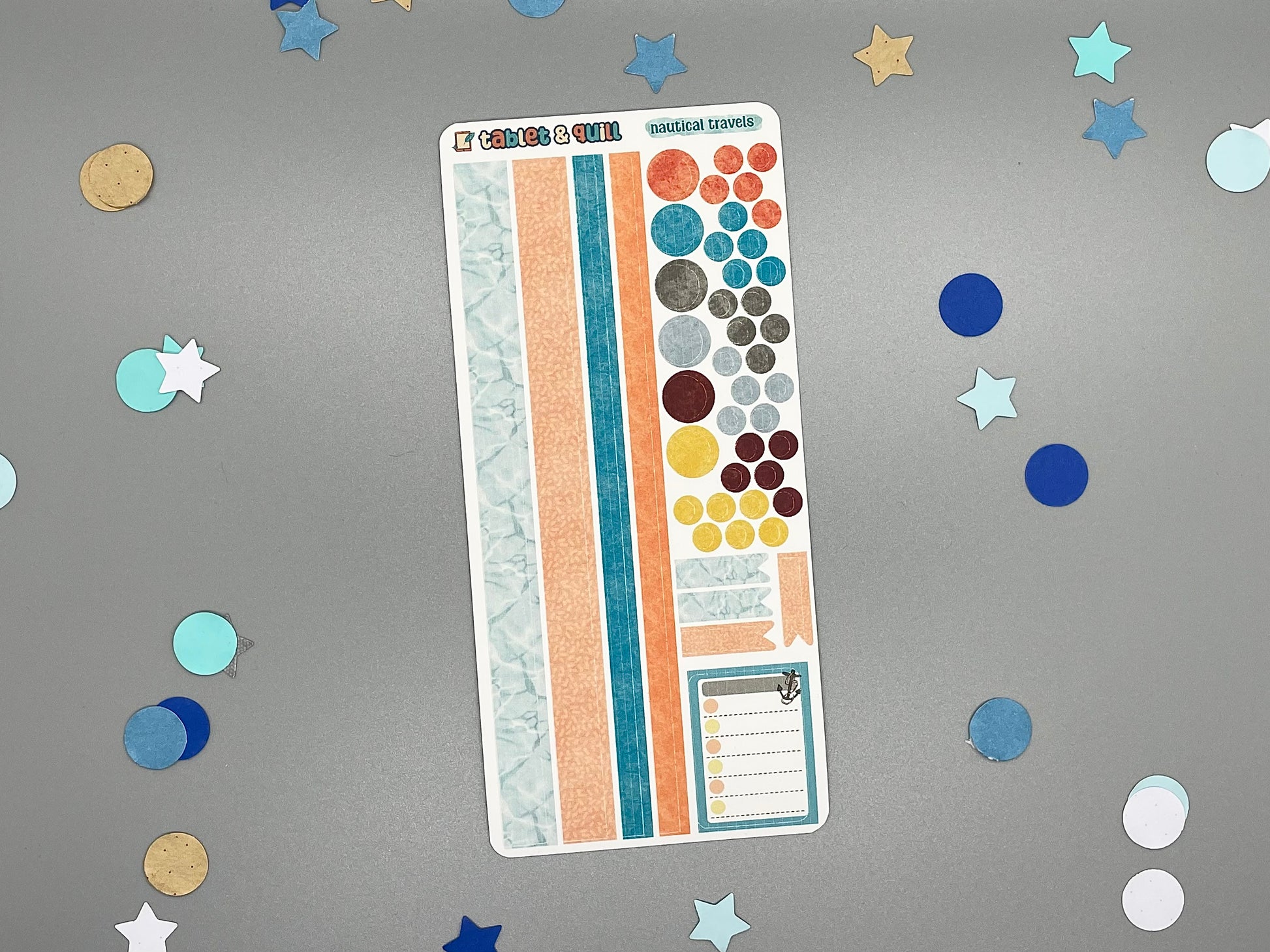 Sticker sheet with matching design as our nautical themed stickers on a gray background with decorative stars and circles.