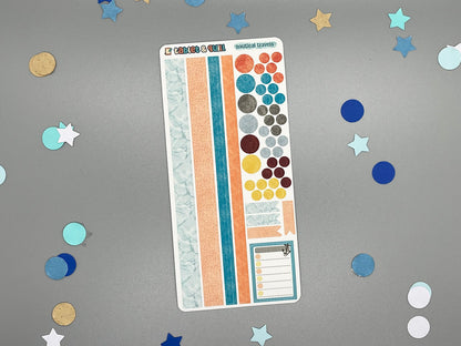 Sticker sheet with matching design as our nautical themed stickers on a gray background with decorative stars and circles.