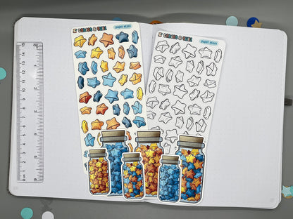 An overview image of paper stars themed stickers, including a color sticker sheet, a colorable sticker sheet, a decorative sticker sheet, and die cut sticker flakes. Ruler on the left.