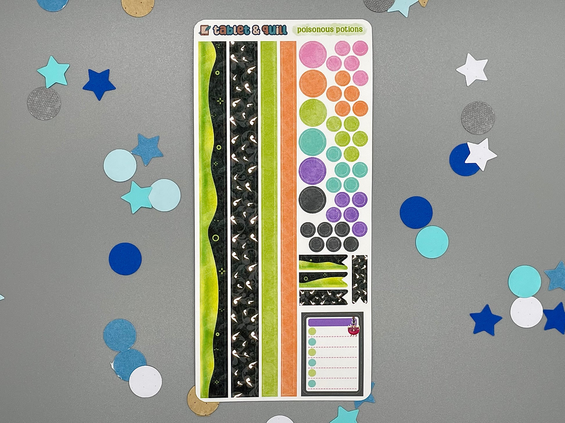 Decorative sticker sheet with washi strips and circle dots that match with the Poisonous Potions sticker set on gray background with confetti.