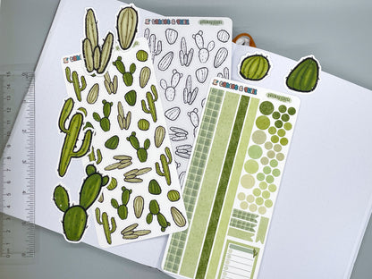 An overview image of cacti themed stickers, including a color sticker sheet, a colorable sticker sheet, a decorative sticker sheet, and die cut sticker flakes. Ruler on the left. 
