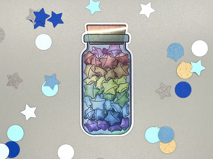 Holographic laminated pride stickers. Paper stars in a jar. Rainbow flag colors.
