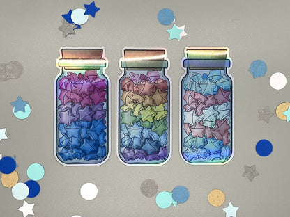 Holographic laminated pride stickers. Paper stars in a jar. Rainbow, bisexual, transgender flag colors.