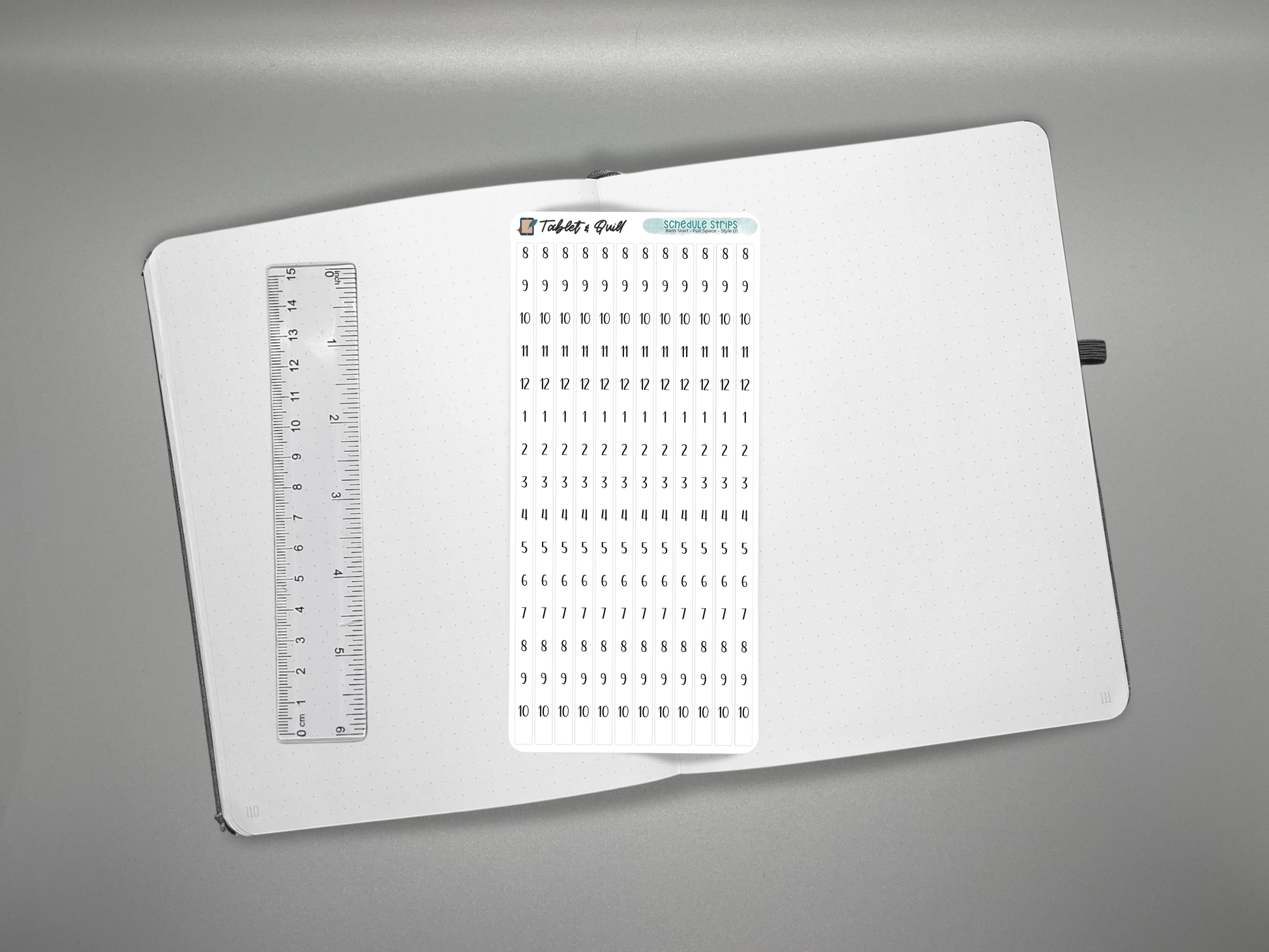 Schedule time blocking sticker sheet on a journal with a ruler for scale over a gray background.