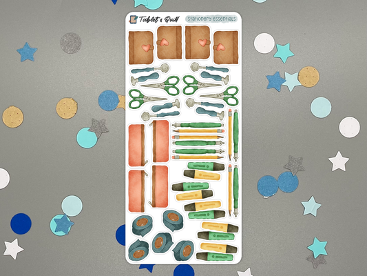 Stationery themed bullet journal sticker sheet in color on a gray background with confetti.