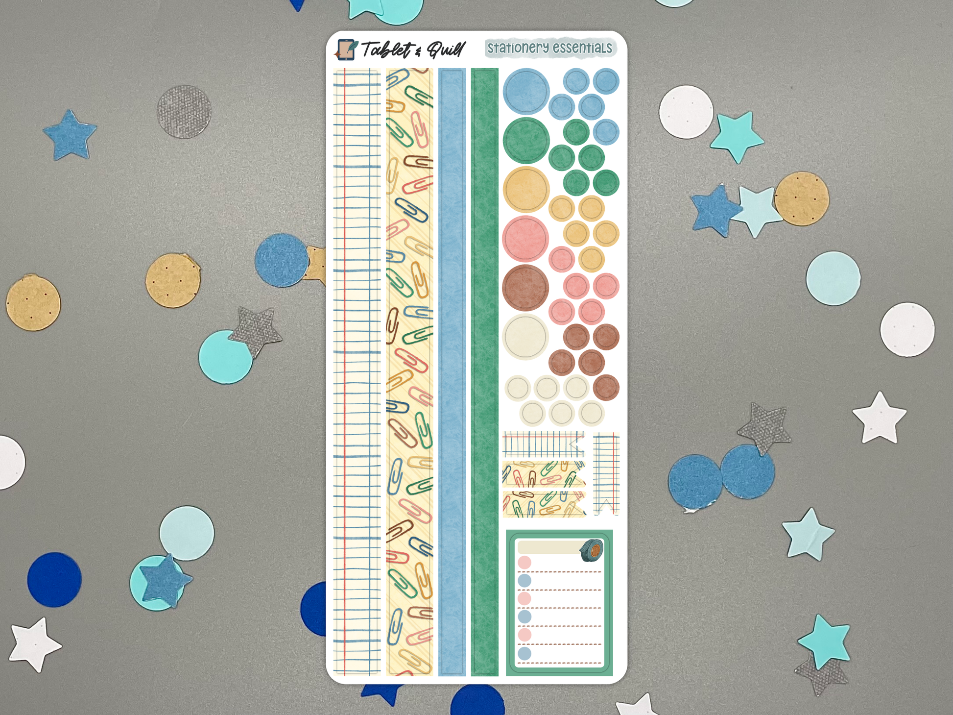 Stationery themed decorative bullet journal sticker sheet on a gray background with confetti.