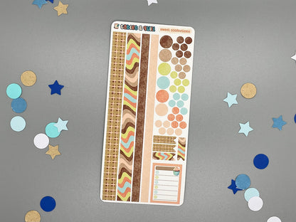 Sticker sheet with various designs on a gray background with decorative confetti.