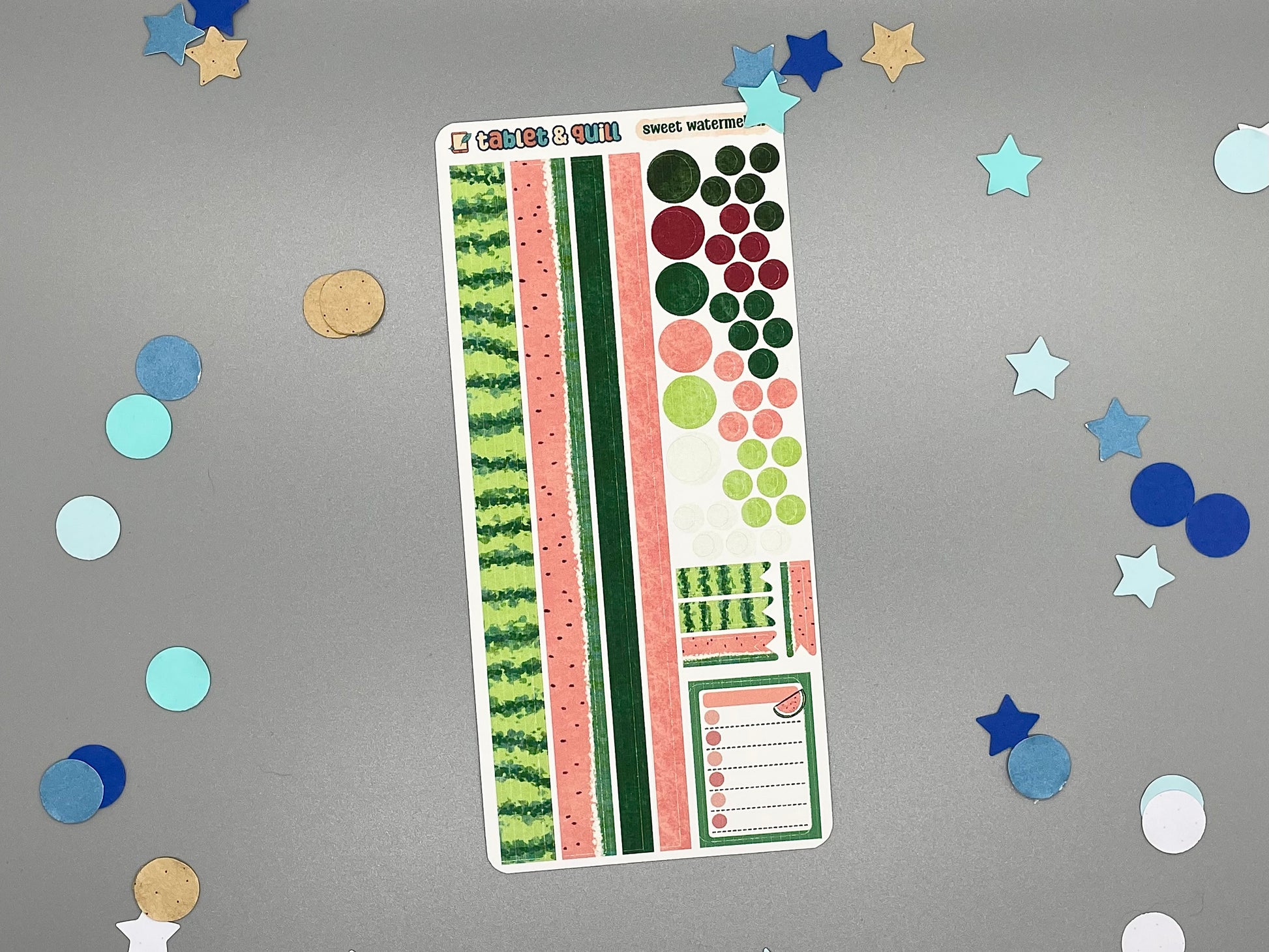 Sticker sheet with watermelon design on a gray background with decorative stars and circles.