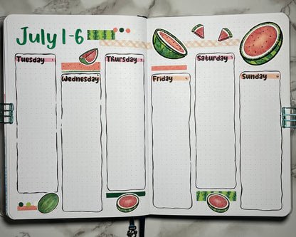 Bullet journal weekly spread with watermelon-themed design on a marble surface
