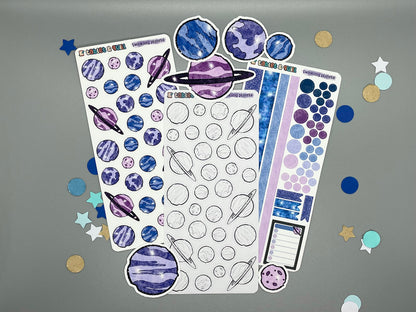 Twinkling planets sticker sheets and die cut stickers on gray background with confetti.