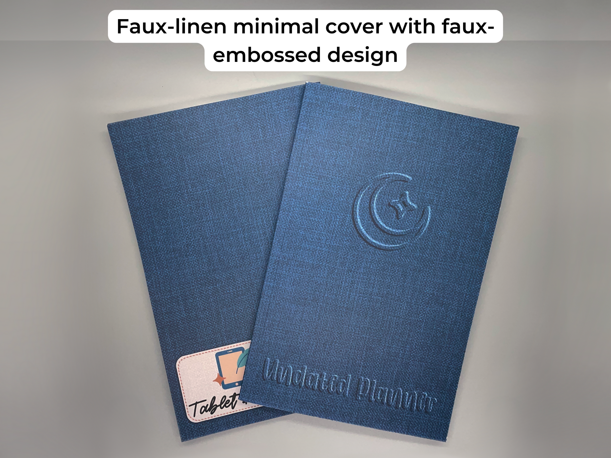 Faux-linen minimal cover with faux-embossed design. Two undated planners, one is showing the back.