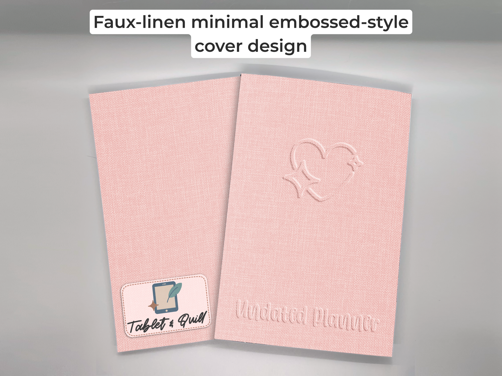 Pink planner with embossed design on a gray background