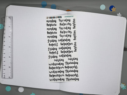 Sticker sheet of weekdays lettering in a script style. Named weekdays 06. Ruler for scale on left.